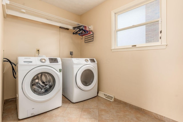 5946 Lisa St, Columbus, OH 43231 - laundry room with separate washer and dryer and baseboards