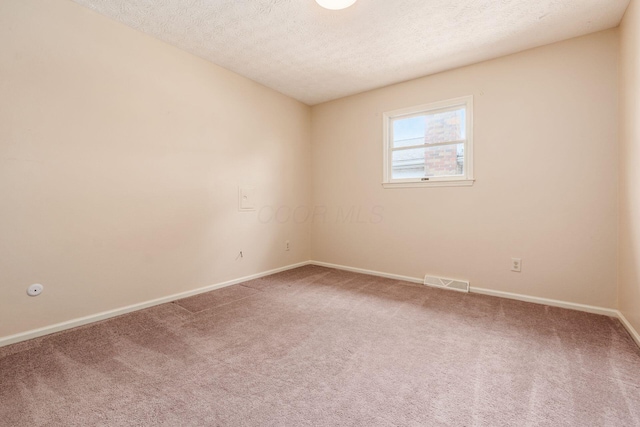 5946 Lisa St, Columbus, OH 43231 - empty room featuring carpet floors and a textured ceiling