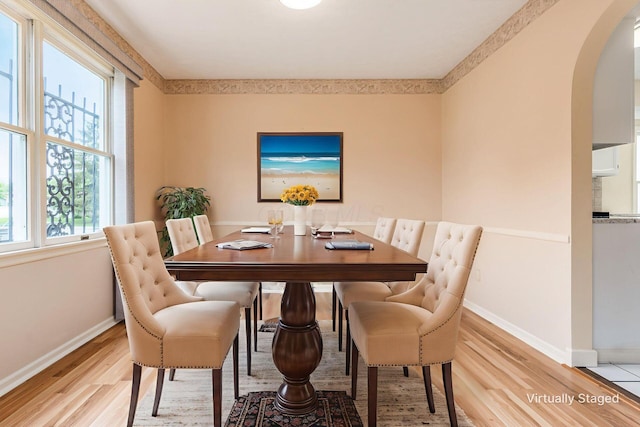 5946 Lisa St, Columbus, OH 43231 - dining space featuring light wood finished floors and arched walkways