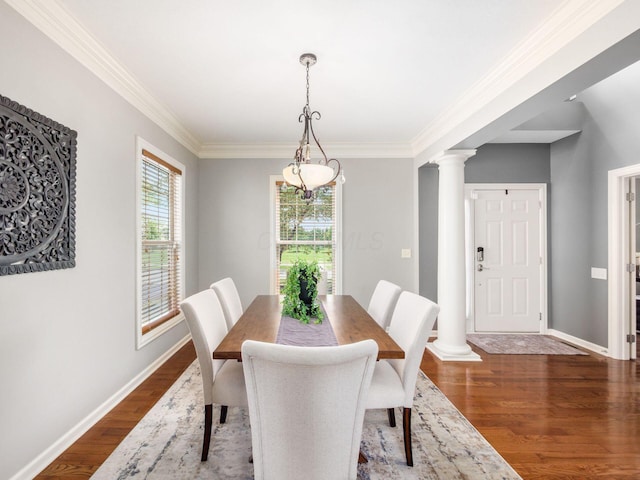 6628 Dalmore Ln, Dublin, OH 43016 - dining space with dark wood-style flooring, crown molding, baseboards, and ornate columns