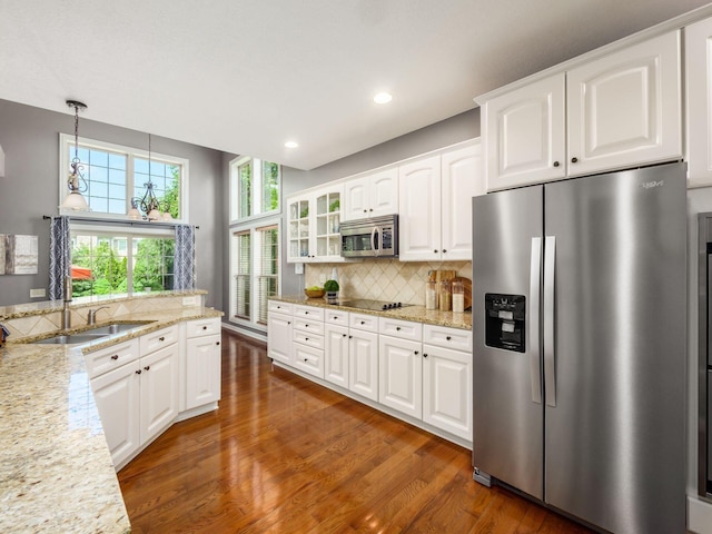 6628 Dalmore Ln, Dublin, OH 43016 - kitchen featuring stainless steel appliances, wood finished floors, backsplash, recessed lighting, and white cabinets