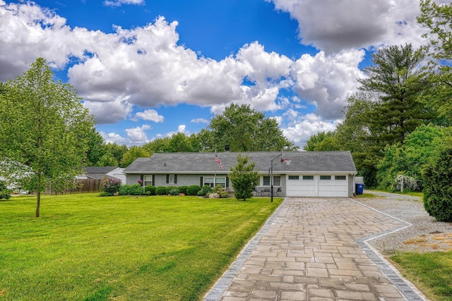 3781 Hines Rd, Columbus, OH 43230 - ranch-style house with a garage, driveway, and a front lawn