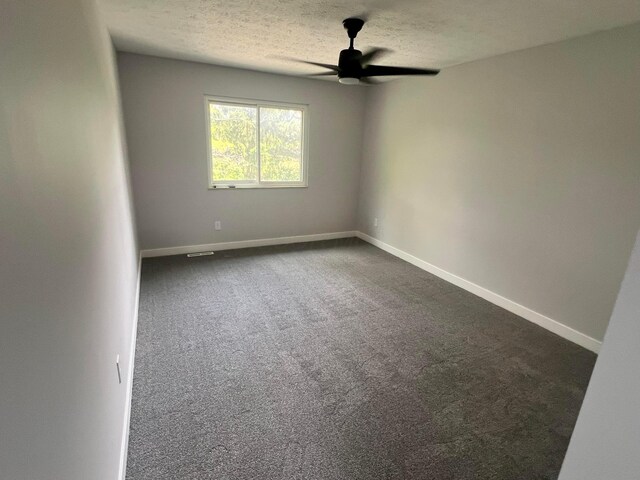 139 Corbins Mill Dr, Dublin, OH 43017 - empty room featuring ceiling fan, dark colored carpet, baseboards, and a textured ceiling