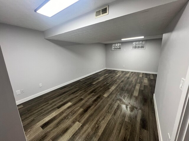 139 Corbins Mill Dr, Dublin, OH 43017 - finished basement featuring dark wood-type flooring and baseboards