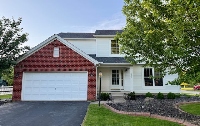 1970 Twin Flower Cir, Grove City, OH 43123 - traditional-style home with asphalt driveway, a garage, a shingled roof, and brick siding