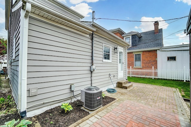 446 E Beck St, Columbus, OH 43206 - view of patio with entry steps, central AC, and fence