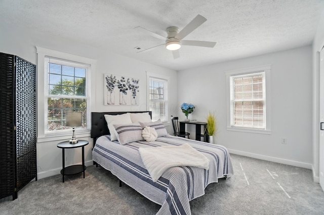 446 E Beck St, Columbus, OH 43206 - carpeted bedroom featuring a textured ceiling, baseboards, and a ceiling fan