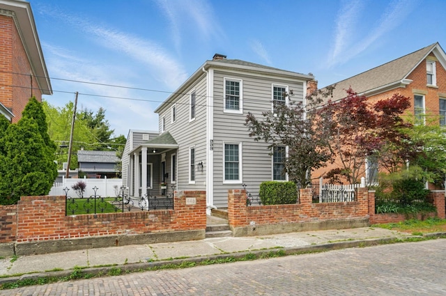 446 E Beck St, Columbus, OH 43206 - view of front of property featuring fence and brick siding