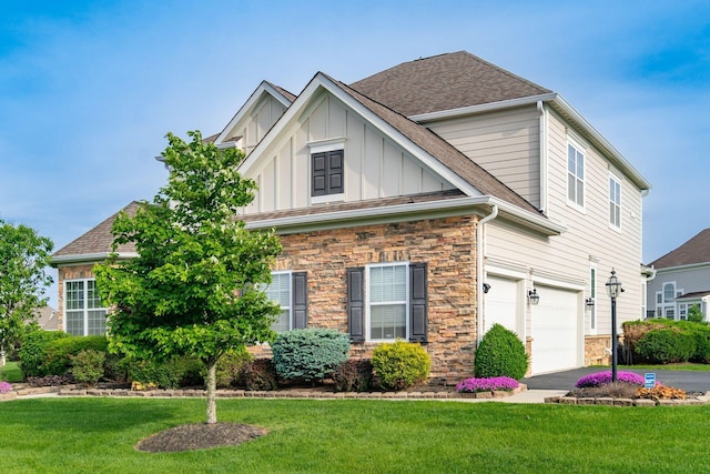 view of front facade featuring a garage, stone siding, and a front yard