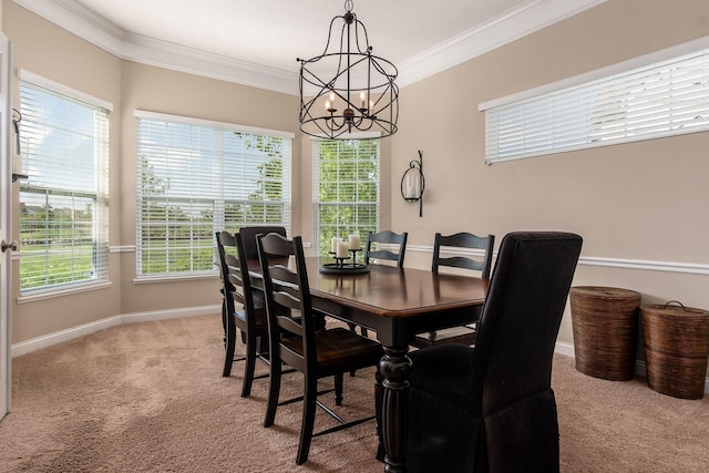 dining space with carpet flooring, a chandelier, crown molding, and baseboards