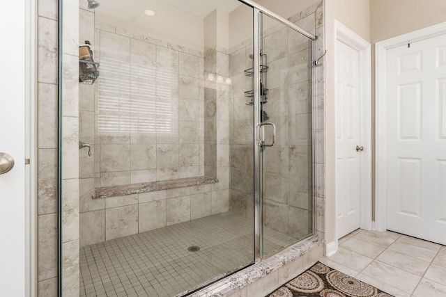 bathroom featuring a shower stall and tile patterned floors