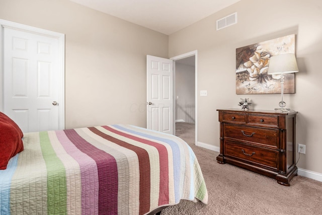 carpeted bedroom featuring baseboards