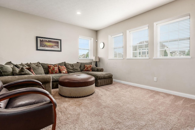 carpeted living room with baseboards and recessed lighting