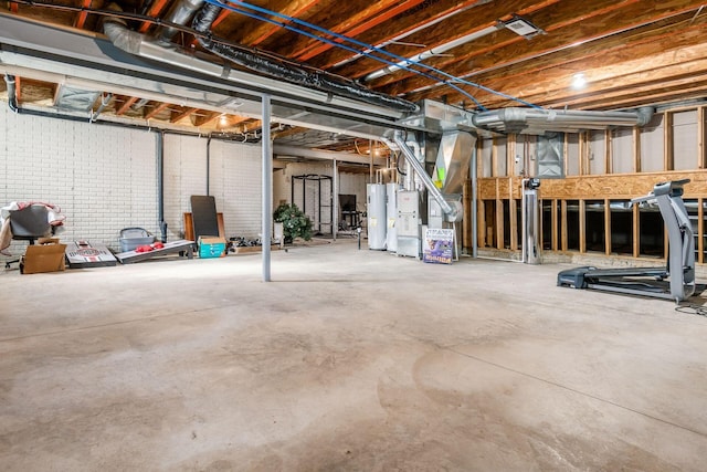 unfinished below grade area featuring gas water heater and heating unit