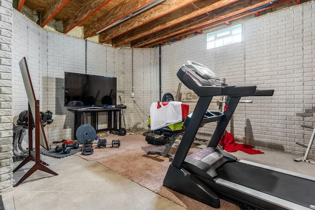 workout area with brick wall