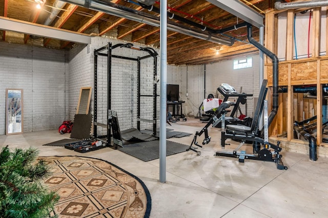 workout room with brick wall