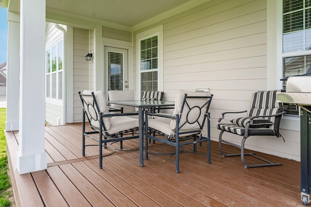 wooden deck with outdoor dining space