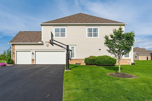 view of side of home featuring a lawn, asphalt driveway, roof with shingles, and an attached garage