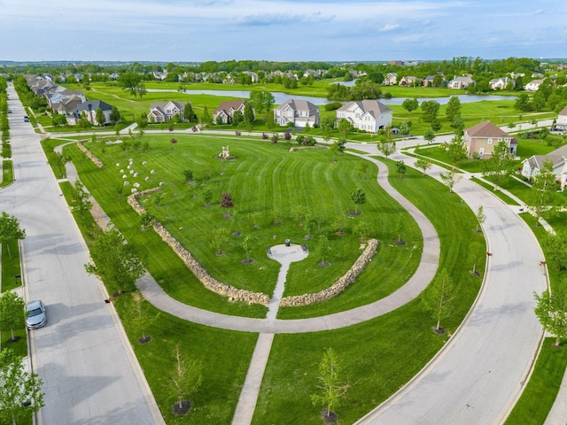 aerial view of residential area with a large body of water