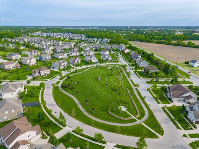 aerial view of property and surrounding area with nearby suburban area