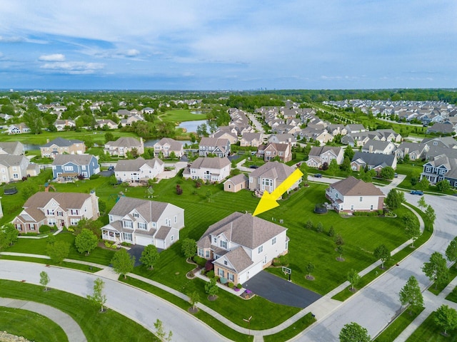 aerial perspective of suburban area featuring a large body of water