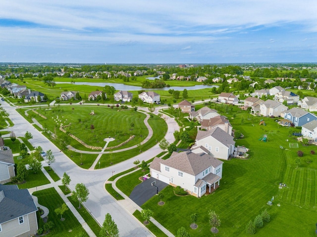 aerial perspective of suburban area with a large body of water