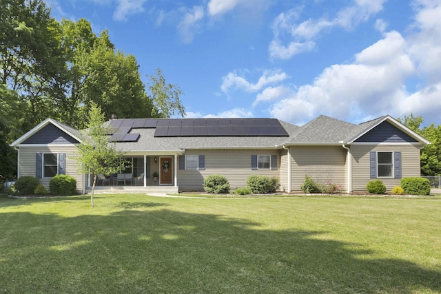 80 Baltimore Somerset Rd NW, Baltimore, OH 43105 - ranch-style home with solar panels, a front yard, and a shingled roof