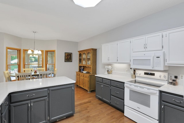 80 Baltimore Somerset Rd NW, Baltimore, OH 43105 - kitchen with white appliances, gray cabinetry, and white cabinets