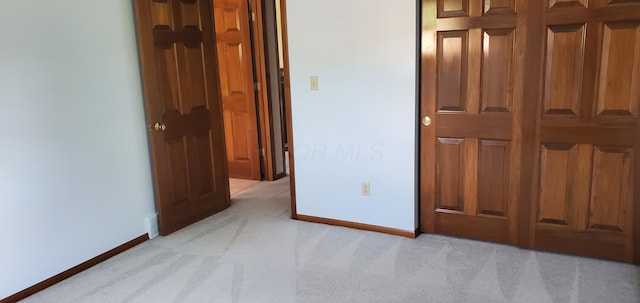 4993 Shadycrest Rd, Columbus, OH 43229 - unfurnished bedroom with light carpet and baseboards