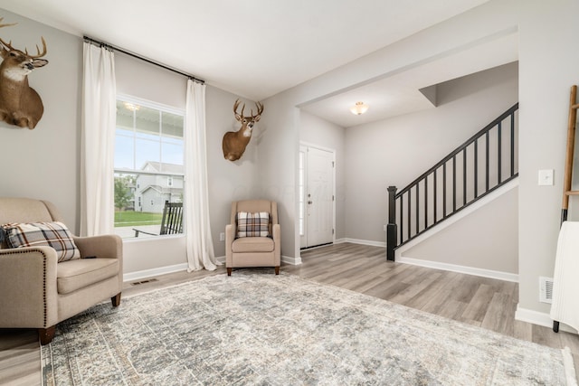 417 Oakland Hills Loop, Commercial Point, OH 43116 - living area featuring wood finished floors, stairs, and baseboards