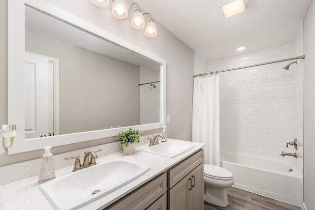417 Oakland Hills Loop, Commercial Point, OH 43116 - bathroom with wood finished floors, shower / bath combination with curtain, toilet, and double vanity