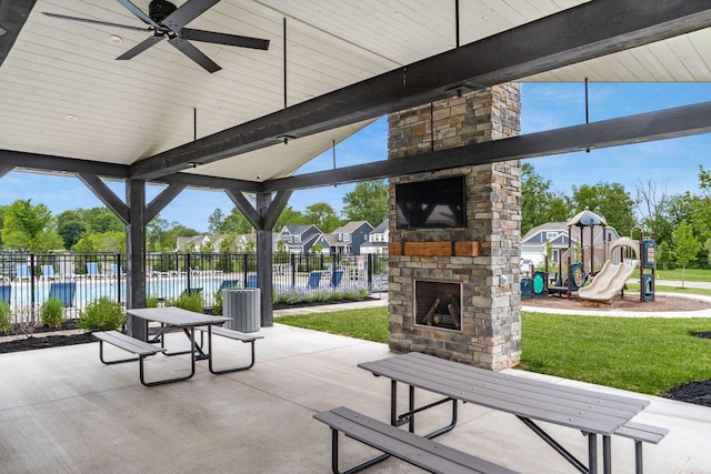 417 Oakland Hills Loop, Commercial Point, OH 43116 - view of patio / terrace featuring an outdoor stone fireplace and central air condition unit