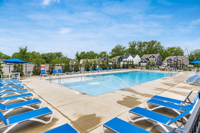 417 Oakland Hills Loop, Commercial Point, OH 43116 - community pool featuring a patio area