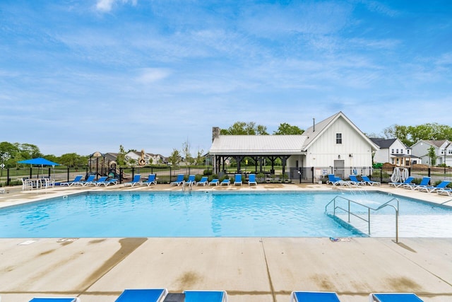 417 Oakland Hills Loop, Commercial Point, OH 43116 - community pool featuring a patio area