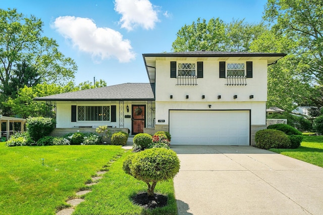 723 W Winmar Pl, Westerville, OH 43081 - split level home featuring an attached garage, driveway, a front yard, and stucco siding