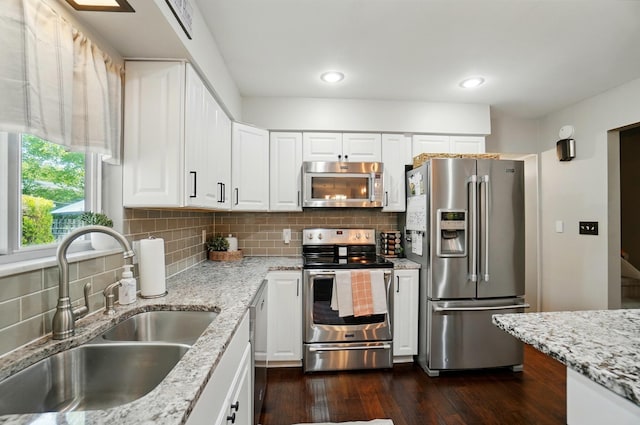 723 W Winmar Pl, Westerville, OH 43081 - kitchen with stainless steel appliances, a sink, dark wood finished floors, white cabinets, and recessed lighting