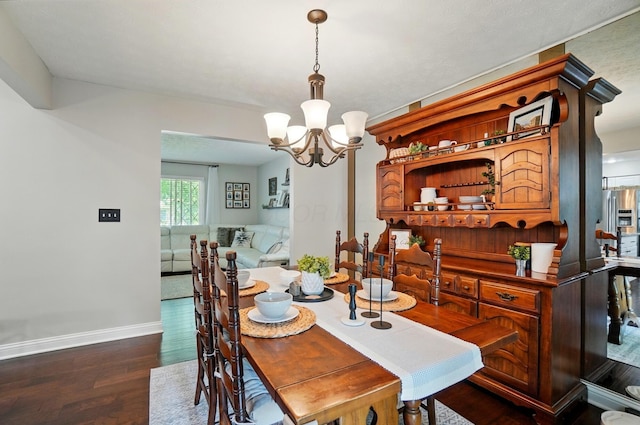 723 W Winmar Pl, Westerville, OH 43081 - dining area with dark wood-type flooring, baseboards, and a chandelier