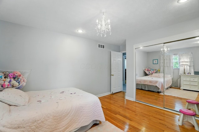 723 W Winmar Pl, Westerville, OH 43081 - bedroom with a chandelier, wood finished floors, recessed lighting, baseboards, and a closet