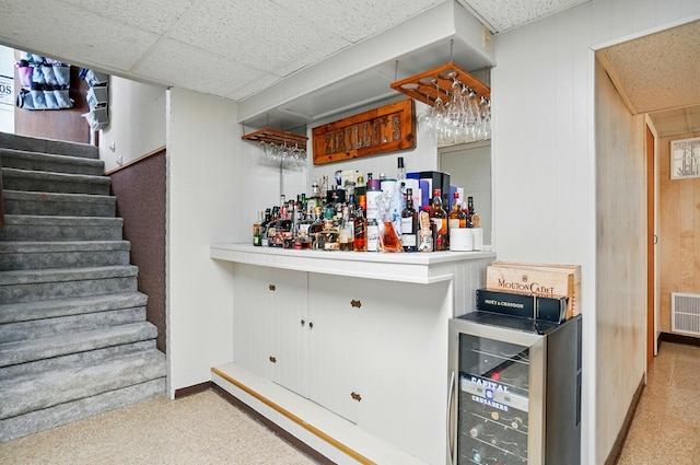 723 W Winmar Pl, Westerville, OH 43081 - indoor dry bar with wine cooler, carpet floors, stairway, wood walls, and baseboards