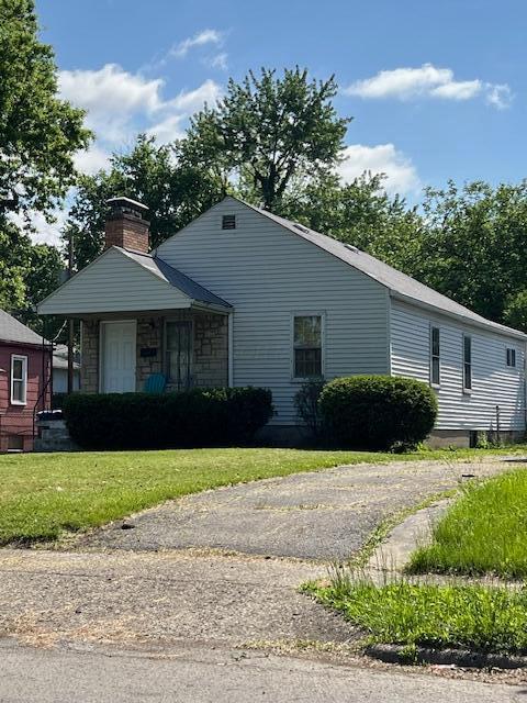 208 S Weyant Ave, Columbus, OH 43213 - view of front of home with a front yard and a chimney