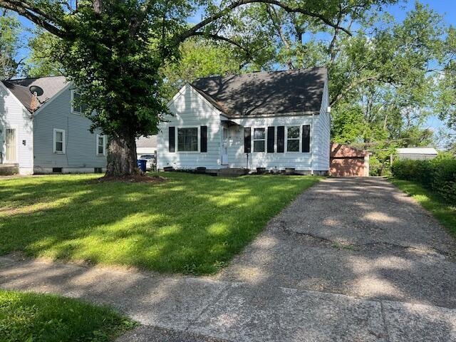 1575 Vendome Dr S, Columbus, OH 43219 - view of front of house with a front yard, an outbuilding, and a detached garage