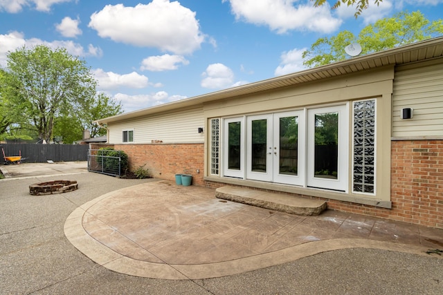 293 Flint Ridge Dr, Columbus, OH 43230 - rear view of property with a fire pit, brick siding, a patio area, and french doors