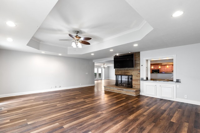 293 Flint Ridge Dr, Columbus, OH 43230 - unfurnished living room featuring a raised ceiling, crown molding, ceiling fan, recessed lighting, and dark wood finished floors