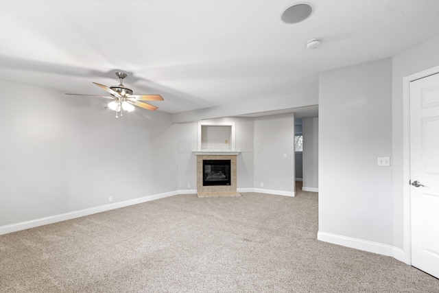 293 Flint Ridge Dr, Columbus, OH 43230 - unfurnished living room with a tiled fireplace, a ceiling fan, light colored carpet, and baseboards