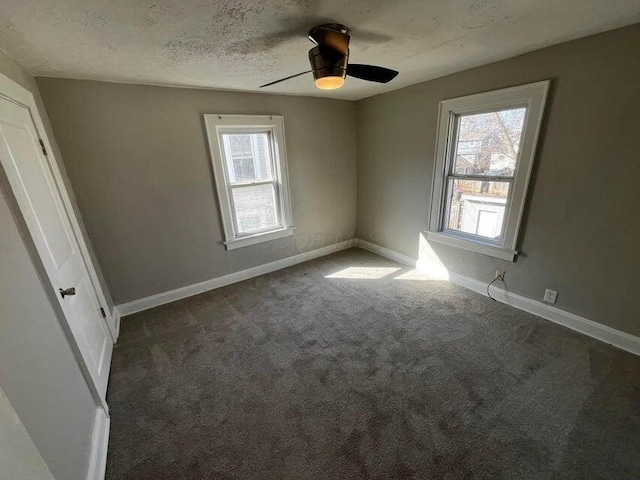 427 S Ogden Ave, Columbus, OH 43204 - carpeted spare room with baseboards, a ceiling fan, and a textured ceiling