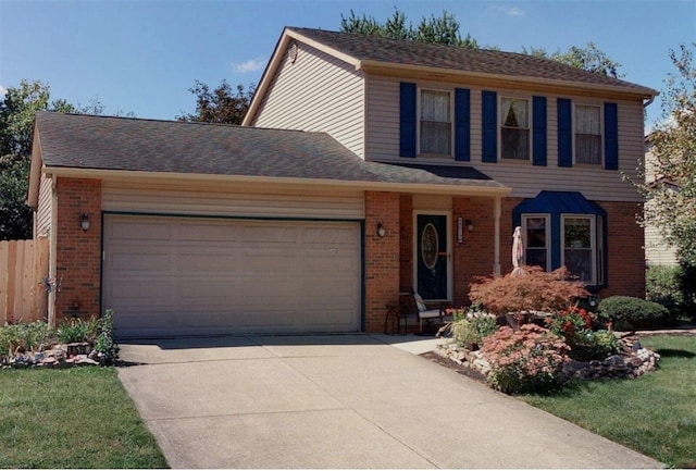 8519 Nimitz Dr, Powell, OH 43065 - view of front of home featuring brick siding, a garage, and driveway