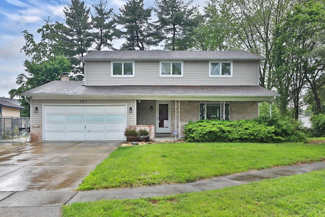 327 Warlock Ct, Columbus, OH 43230 - view of front facade featuring brick siding, a front yard, driveway, a porch, and a chimney