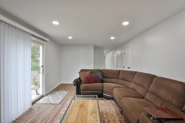 327 Warlock Ct, Columbus, OH 43230 - living room with wood finished floors, recessed lighting, and baseboards