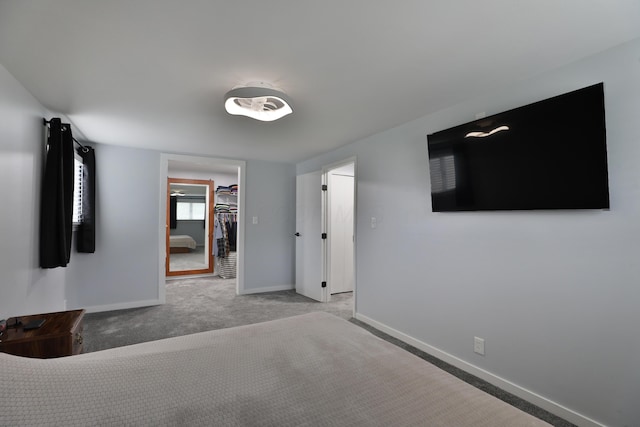 327 Warlock Ct, Columbus, OH 43230 - unfurnished bedroom with baseboards, light colored carpet, and a spacious closet