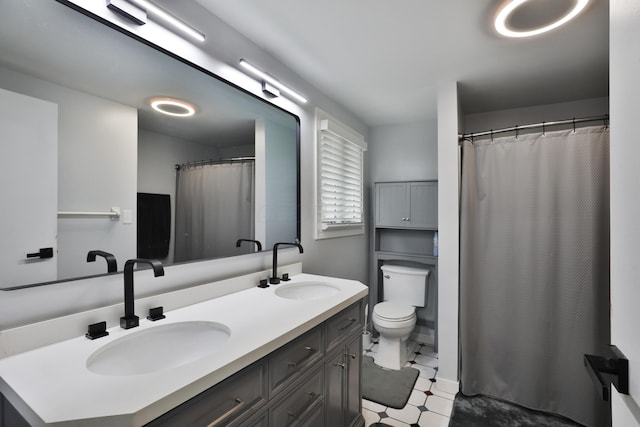 327 Warlock Ct, Columbus, OH 43230 - bathroom featuring double vanity and toilet